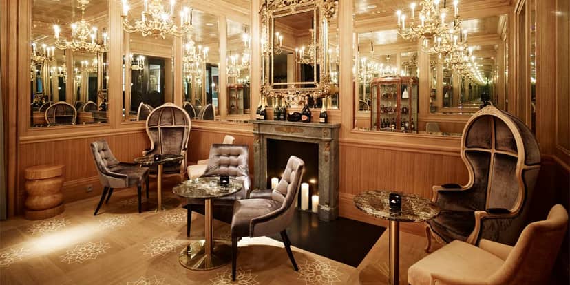 Luxury hotel breakout space with high-backed chairs for VIP networking events.