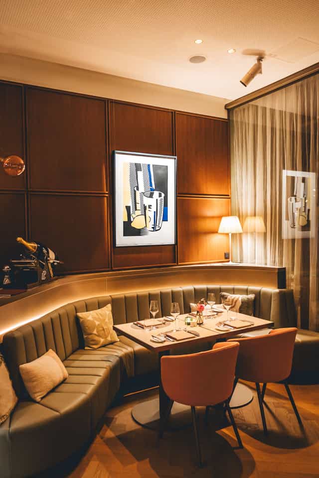 Veranda Brasserie VIP dinner or board meeting with elegant banquette seating and ambient lighting.