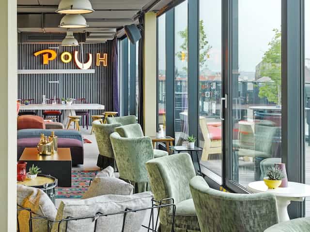 Rooftop bar lounge at 25hours Hotel with eclectic decor for networking and corporate events.