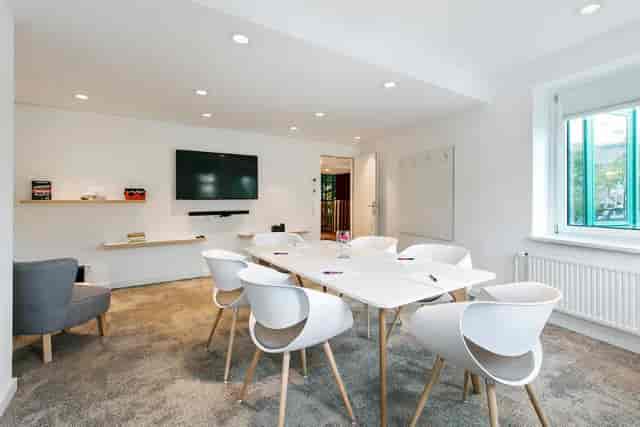 Minimalist boardroom at ARCOTEL Wimberger Wien for small team strategy meetings and business events.