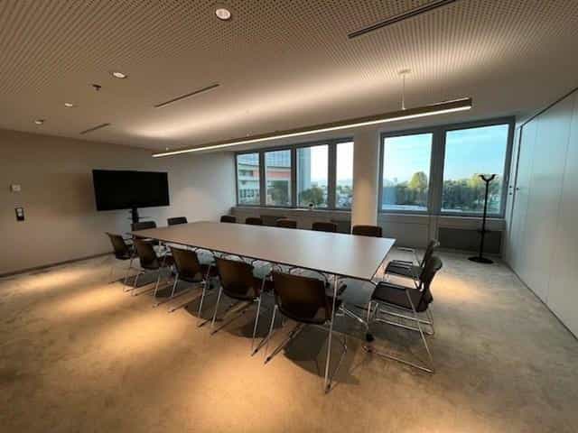 IZD Tower boardroom with rectangular table for business meetings and project briefings.