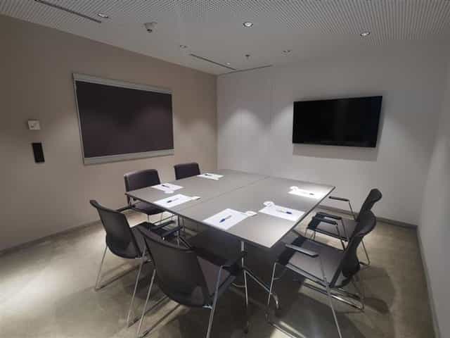 IZD Tower breakout room with AV equipment for corporate workshops and team meetings.
