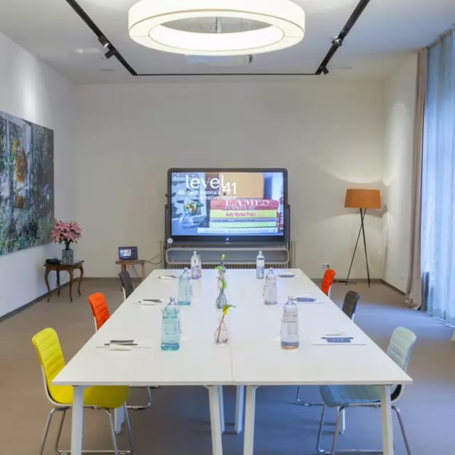 Modern boardroom in Vienna Altstadt with interactive display for executive meetings and strategy.