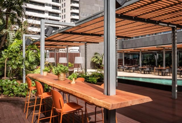 Hotel SB Diagonal terrace with communal table for corporate networking and business events.