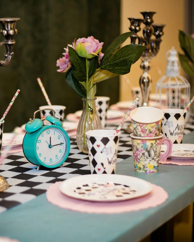 Alice in Wonderland themed tablescape at MuSe Kinder Café for creative birthday party decor.