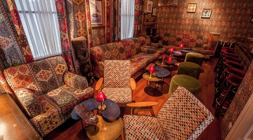 Maximalist lounge at One O One, intimate setting for high-end networking and corporate breakout.