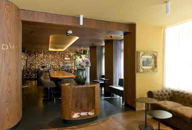 VIP networking lounge at Hotel Beethoven with sophisticated soft seating and breakout tables.