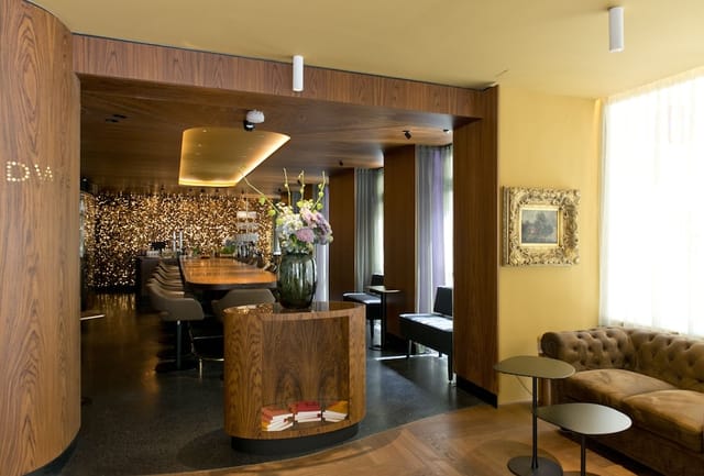 VIP networking lounge at Hotel Beethoven with sophisticated soft seating and breakout tables.