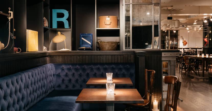Ruby Lissi Hotel bar with tufted booth seating for exclusive client dinners and breakout sessions.