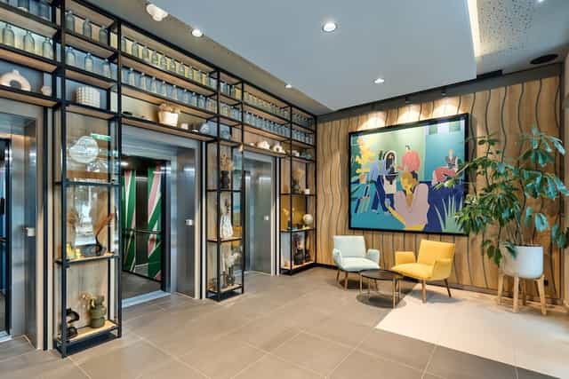 Spark by Hilton Vienna lounge with soft seating for business meetings and corporate events.