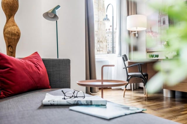 Boutique hotel suite with executive workspace for business travel and meetings.