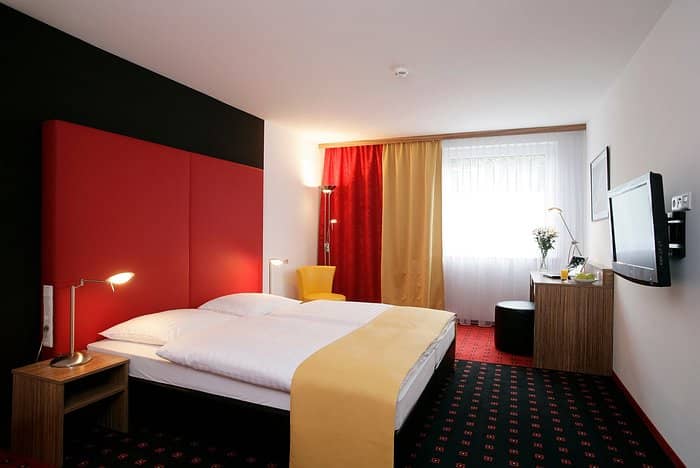 Modern hotel lounge with workspace for business conferences and professional networking events.