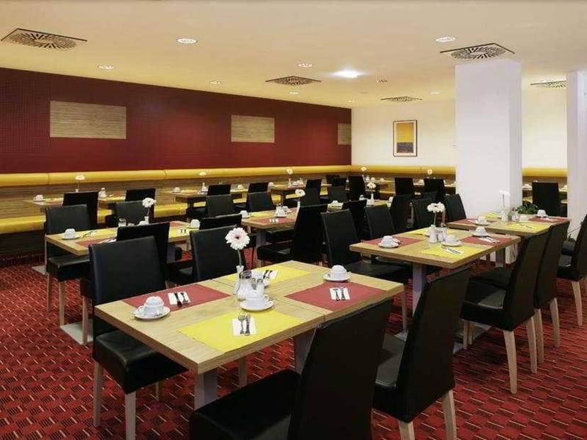 Senator Hotel function room with modular tables for breakfast meetings and corporate events.