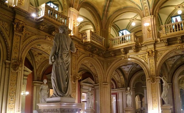 Grand staircase at Vienna State Opera: marble architecture for classical concerts and gala events.