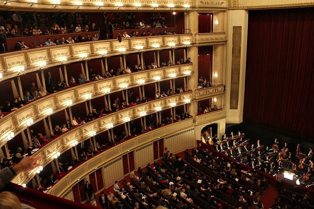 Vienna State Opera Interval Halls: tiered theater seating for gala presentations and plenary events.
