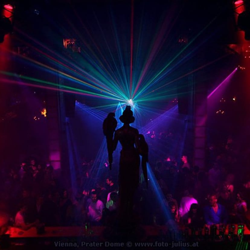 Nightclub silhouette with immersive laser lighting for high-energy gala and event production.