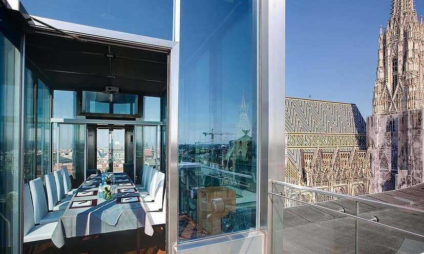 Boardroom at DO & CO Hotel Vienna with panoramic city view for executive meetings and VIP events.
