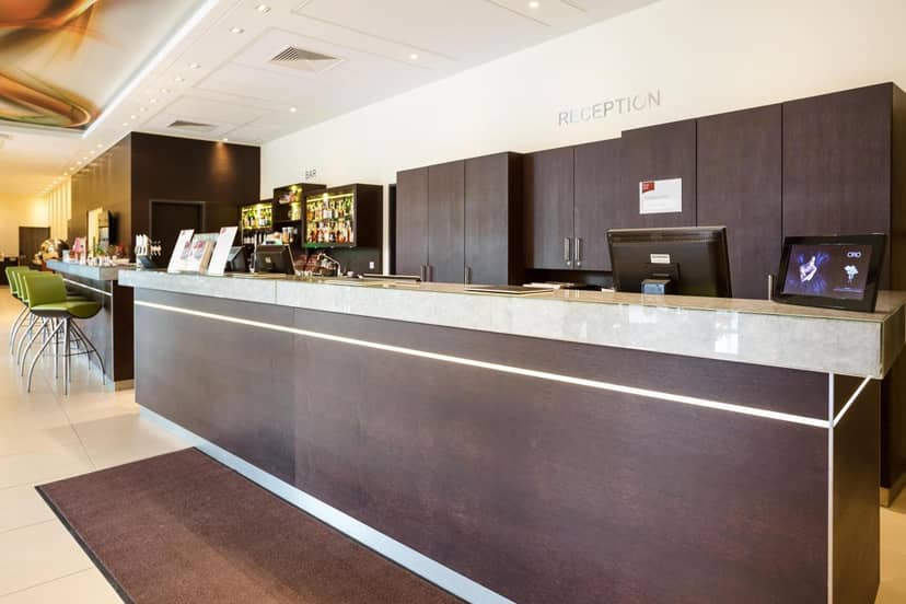 Hotel Doppio reception desk for corporate event registration and check-in.
