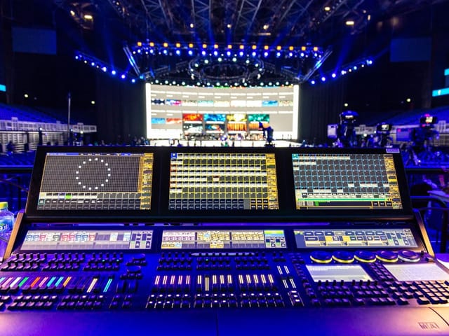 Encore Vienna AV console and lighting rig for immersive corporate event production.