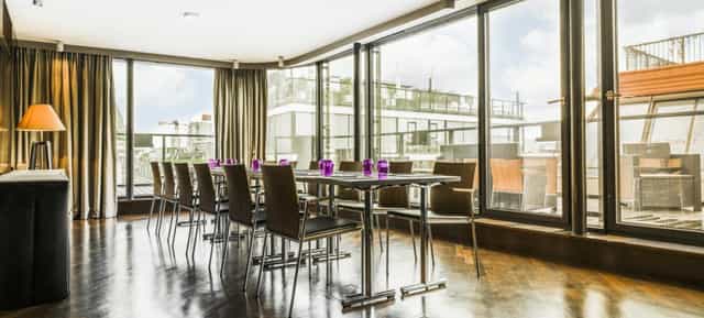 Boardroom in Hotel Topazz Lamee with floor-to-ceiling windows for executive meetings and events.