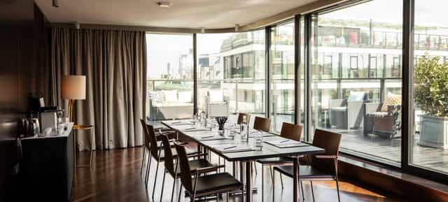 Hotel Topazz Lamee boardroom with floor-to-ceiling windows for intimate corporate event meetings.