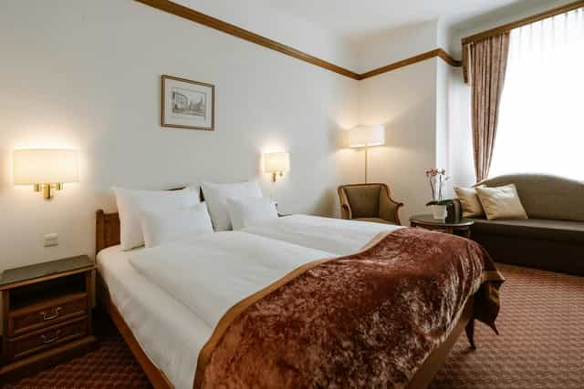 Twin hotel room at Hotel City Central for conference guest blocks and event accommodation.