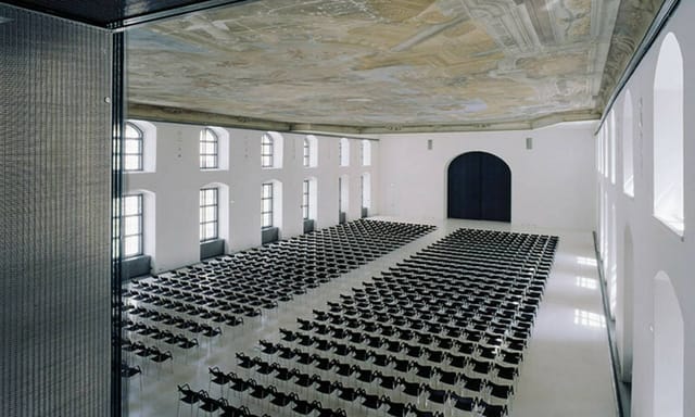 Säulenhalle venue with frescoed ceiling, ideal for corporate summits and professional conferences.