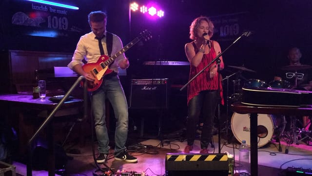Live band performing on stage at Club 1019, ideal for corporate mixers and social events.