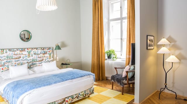 Boutique hotel suite in Vienna with reading nook for VIP corporate retreats and board meetings.