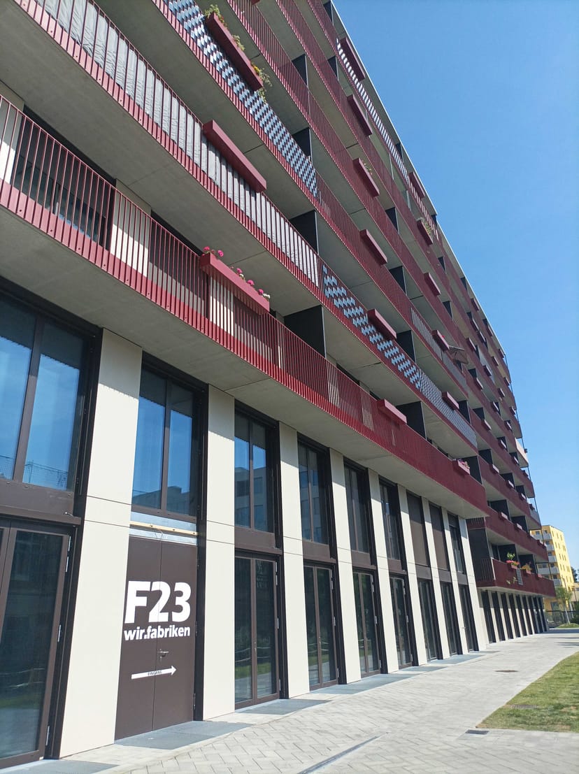 Modern F23 hotel exterior with balconies, ideal for corporate event venue or business room blocks.