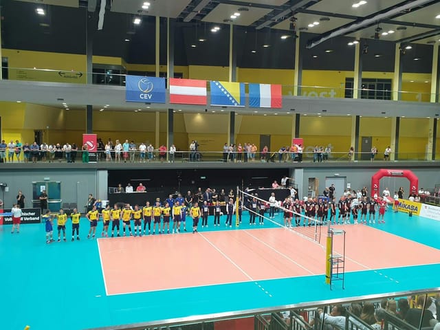 Volleyball tournament at Multiversum Schwechat with multi-level seating and sports venue branding.