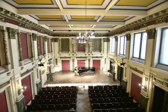 Ehrbar Saal concert hall with elegant stage and rows of seating for formal events and performances.