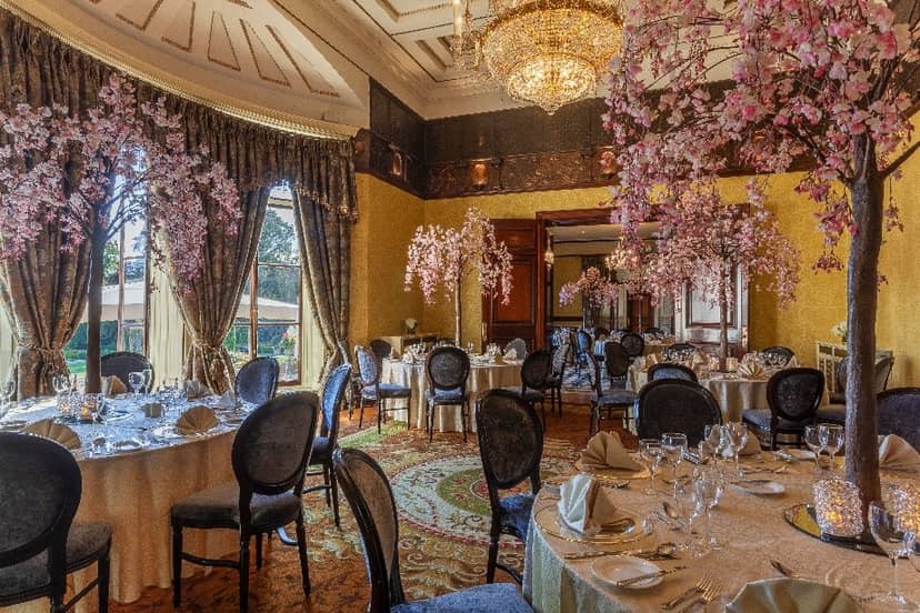 Banquet hall at Radisson Blu Dublin with cherry blossom centerpieces for luxury wedding events.