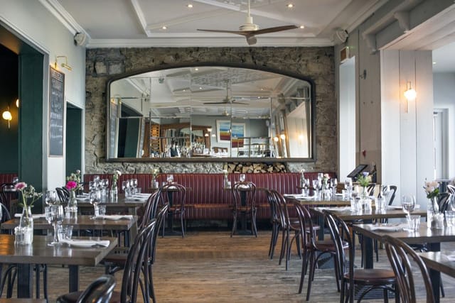 Rustic-chic bar at Haddington House, stone wall venue for private dinner and networking events.