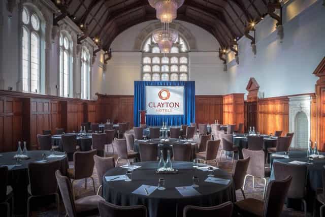 Thomas Prior Hall banquet room with wood paneling, ideal for corporate conferences and events.