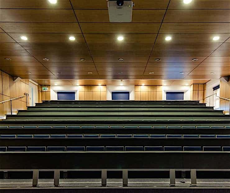 Tiered lecture hall at DCU Conferencing for professional training and keynote presentations.