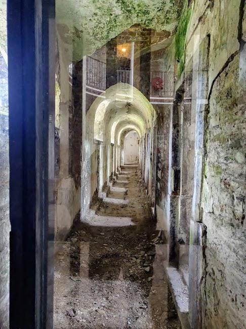 Cork City Gaol interior: rustic stone architecture for historic venue and event site scouting.