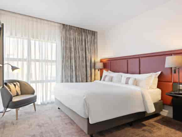 Modern penthouse hotel room with task lighting for corporate events and business room blocks.