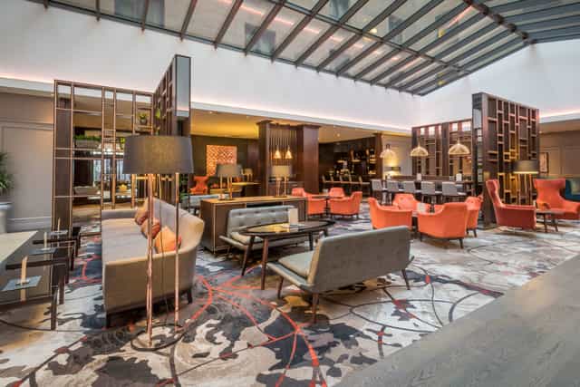 Clayton Hotel Leopardstown atrium: airy event space for networking and corporate conferences.