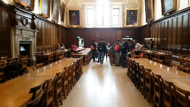 Trinity College Dublin Dining Hall set for formal banquet or academic workshop.