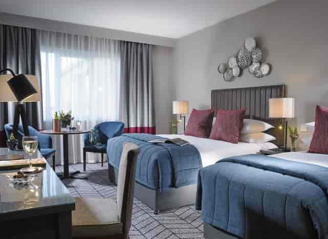 Twin-occupancy hotel room at Fairways Convention Centre for corporate events and business travel.