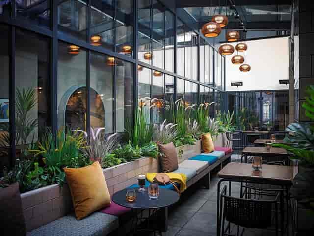 Modern indoor-outdoor event space at Herbert Park Hotel for networking and corporate receptions.