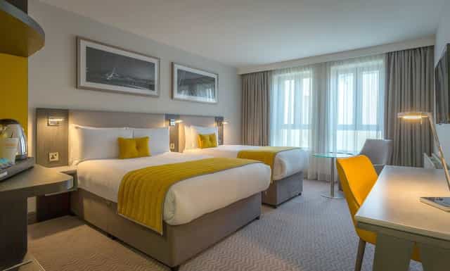 Maldron Hotel Pearse Street twin guest room with workspace for corporate conference accommodation.