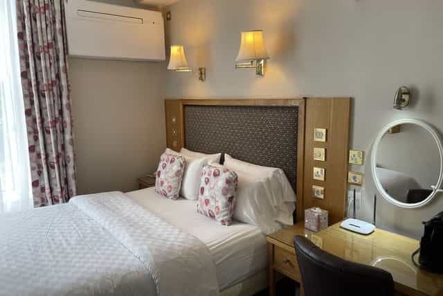 Luxe suite at Roxford Lodge Hotel with workspace, perfect for business travel and hotel booking.