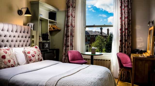 Luxe suite at Roxford Lodge Hotel with workspace, perfect for corporate stays and business travel.