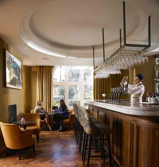 The Ruby Room at Dylan Hotel: Sophisticated lounge for corporate networking and VIP events.