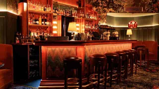 Intimate cocktail lounge at The Curious Mister for VIP networking and conference receptions.