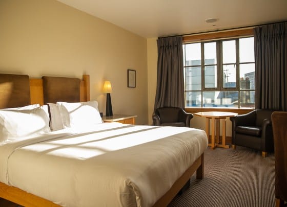 Clarence Suite hotel room with work nook for business travel and corporate stays.