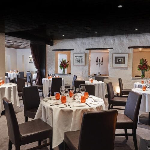 Fine dining restaurant with white tablecloths for corporate dinners and VIP events.