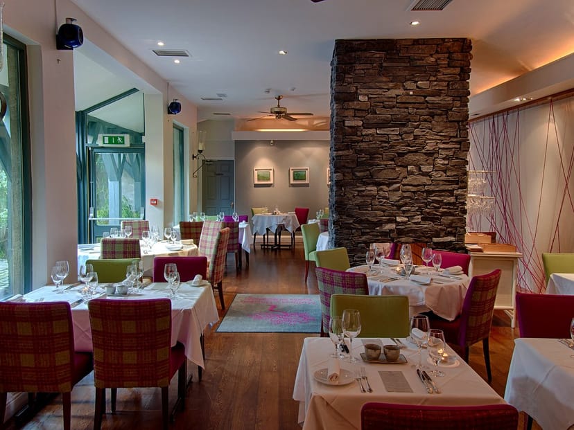 Dax Restaurant private dining room with rustic stone wall, ideal for corporate events and luncheons.